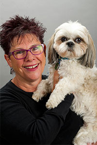 Donna Basiliou, LMT with her dog Cooper.